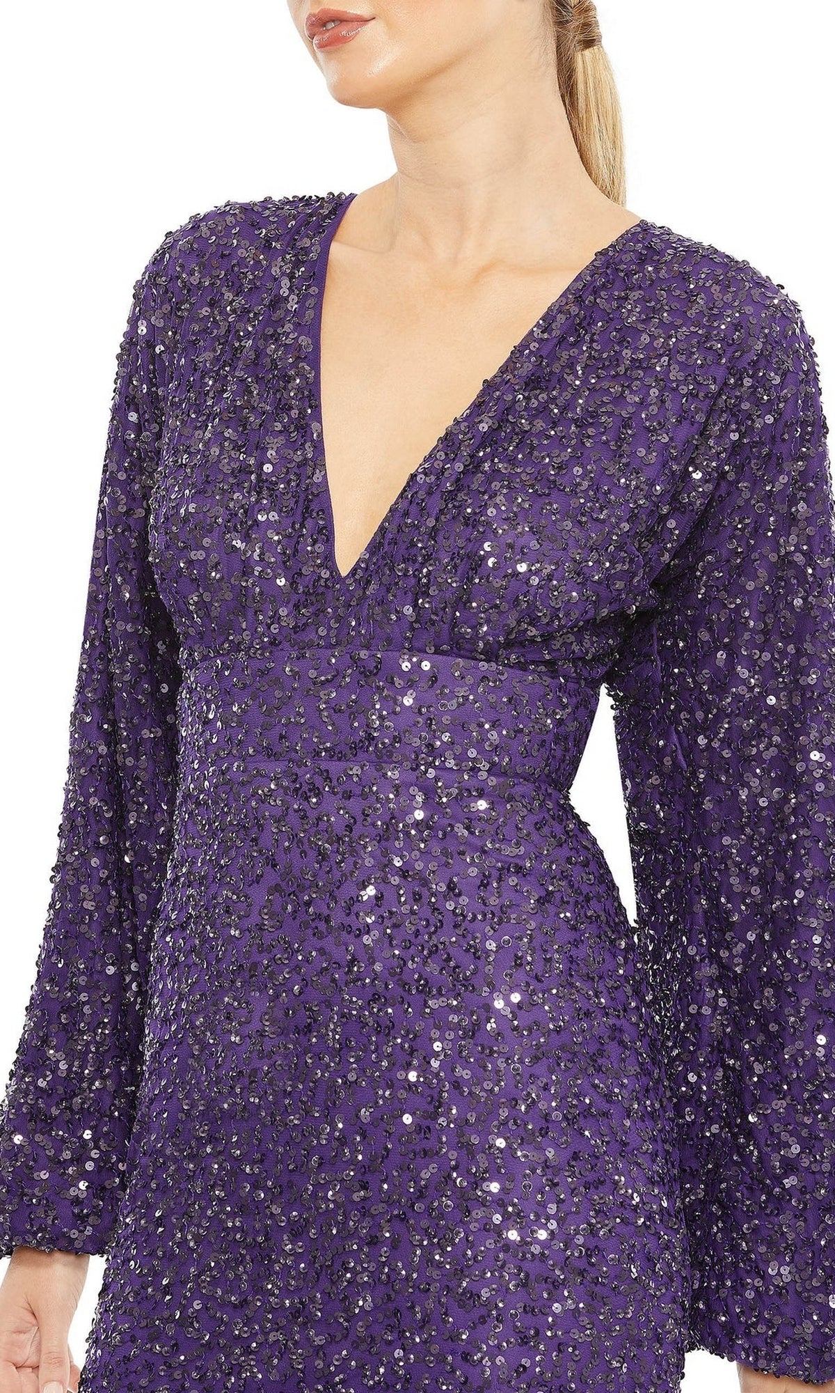 A person wearing a sequin long sleeve Mac Duggal 10791 formal gown with a deep V-neck in purple, shown from shoulders to hips.